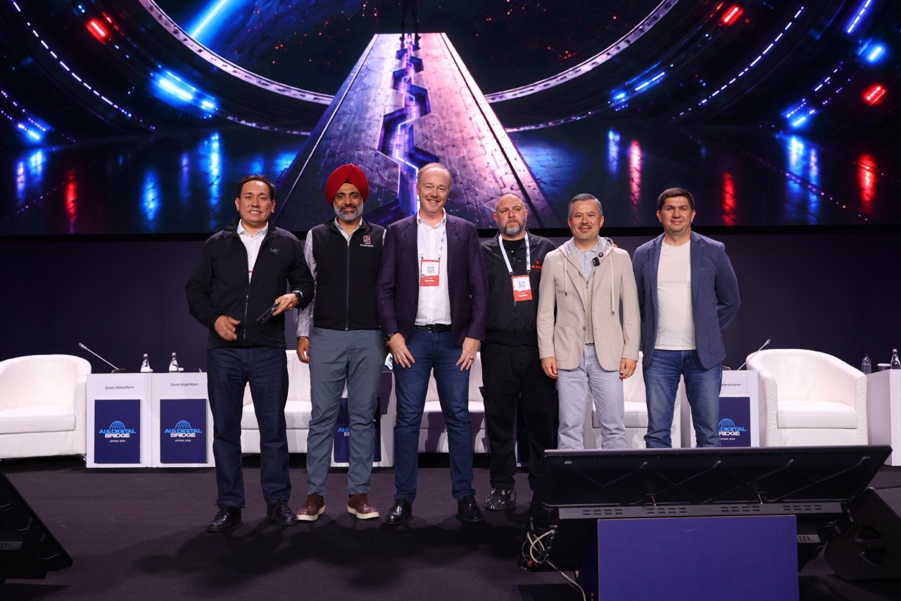 Darsh with five other panelists on the main stage at AI & Digital Bridge