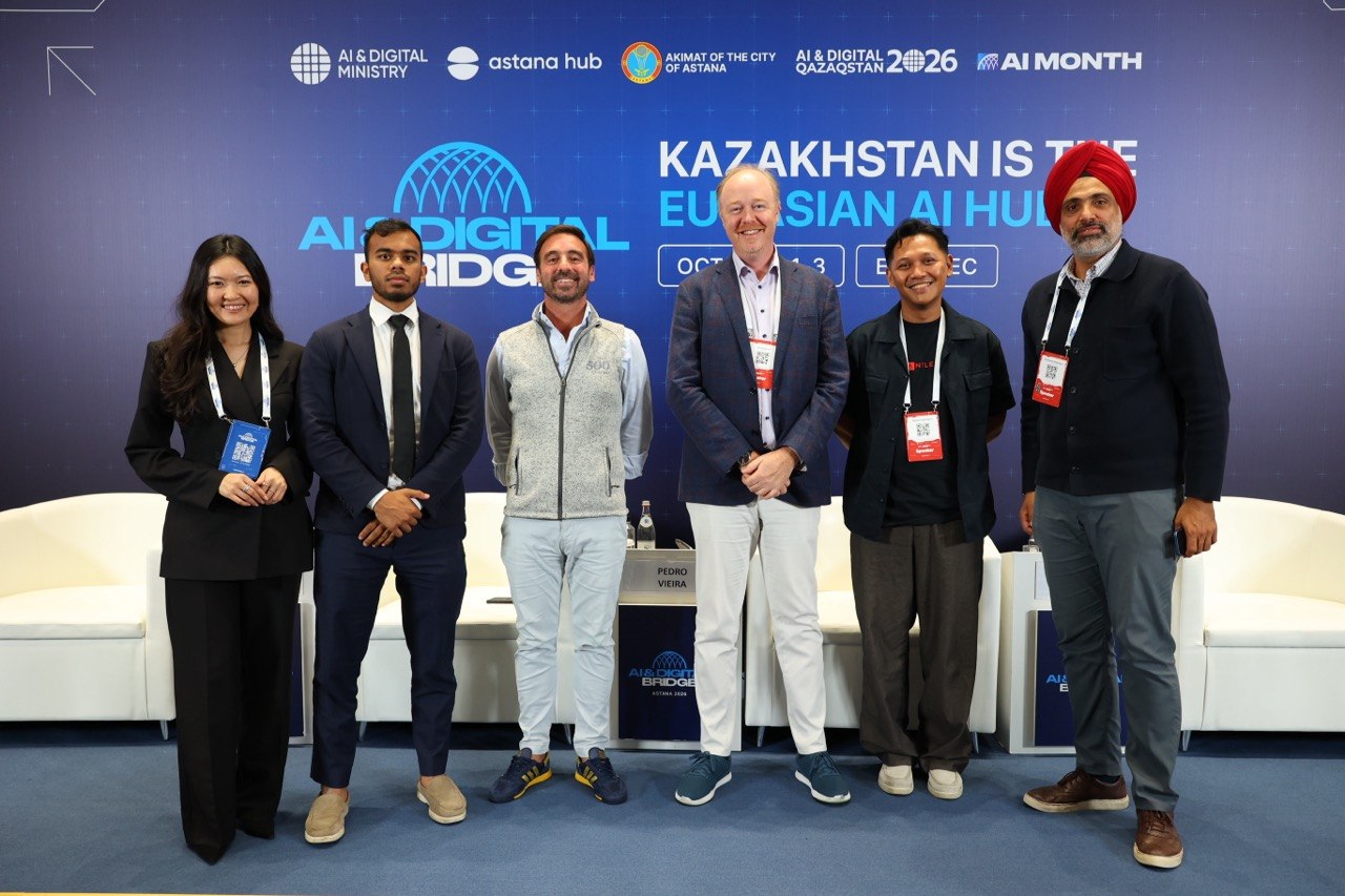 Darsh with five other speakers in front of the AI & Digital Bridge backdrop