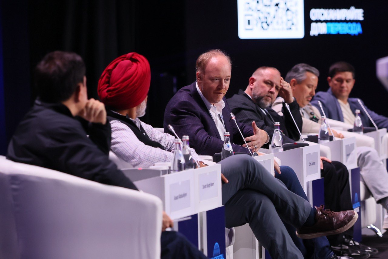 The panel in discussion, Darsh listening in the foreground