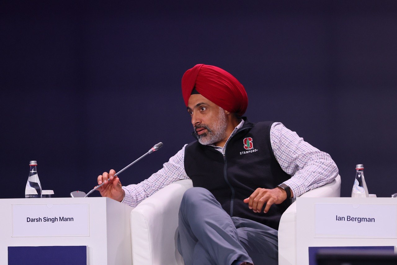 Darsh Singh Mann speaking on the main-stage panel at AI & Digital Bridge in Astana
